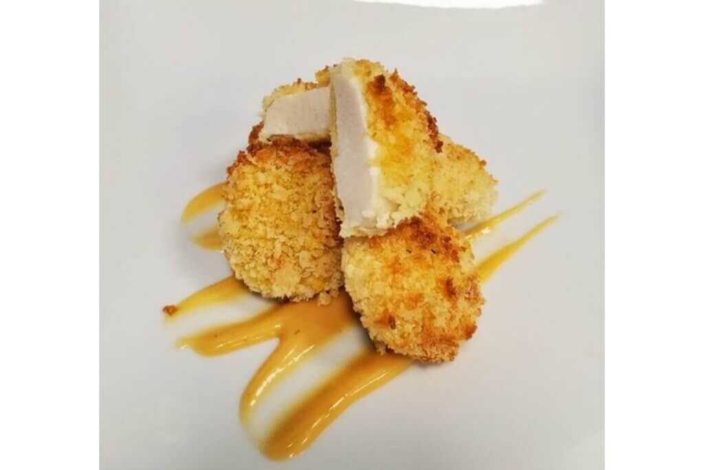 Hybrid cultivated chicken nugget made with Matrix F.T.'s edible and animal component-free microcarriers.
